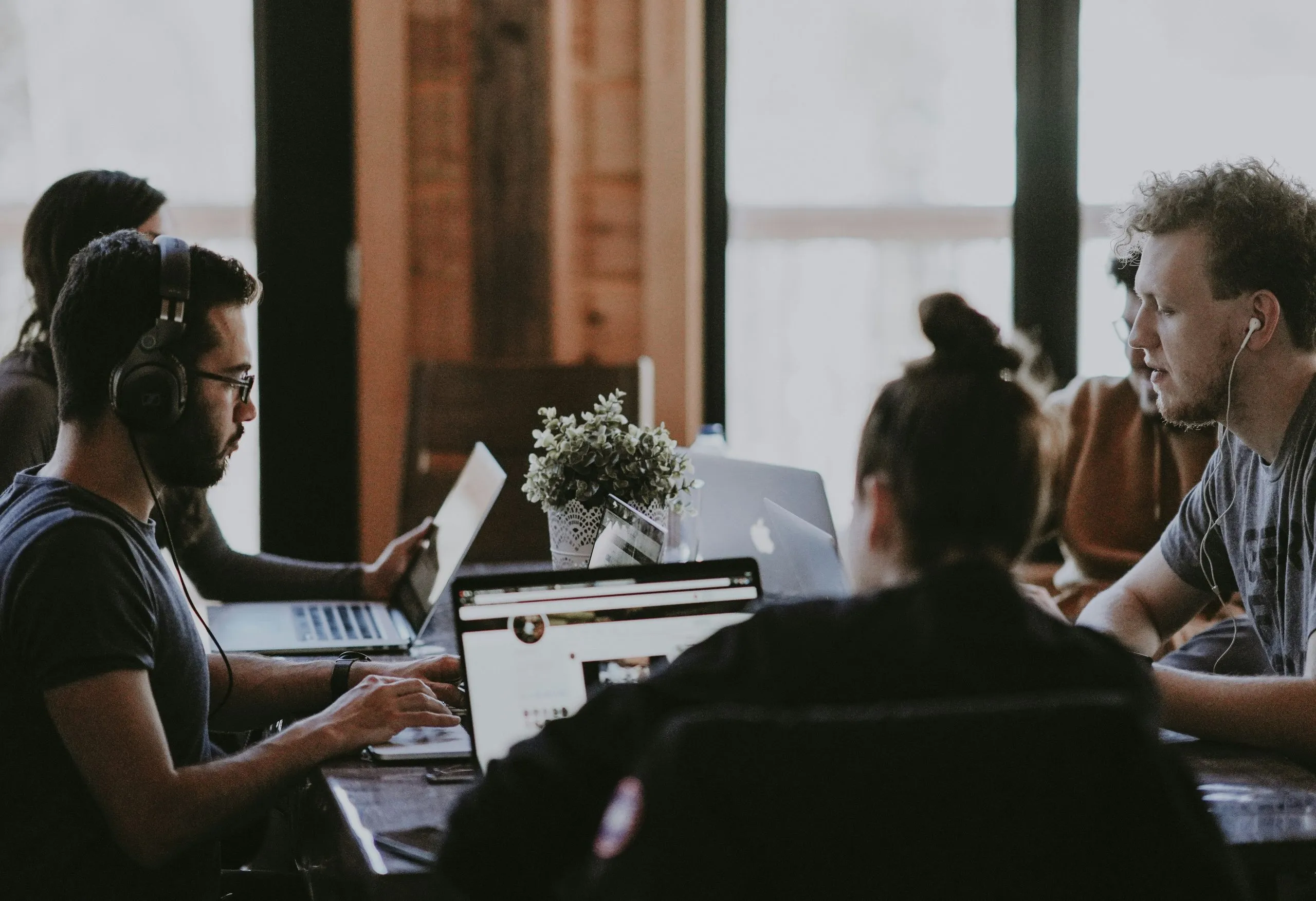 Colleagues working together at a shared desk